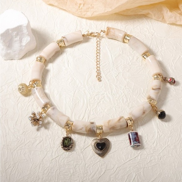 Elegant Cream and Gold Charm Necklace - Picture 3 of 4